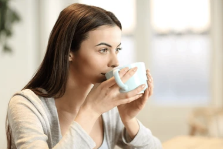 woman calm after chaos drinking coffee
